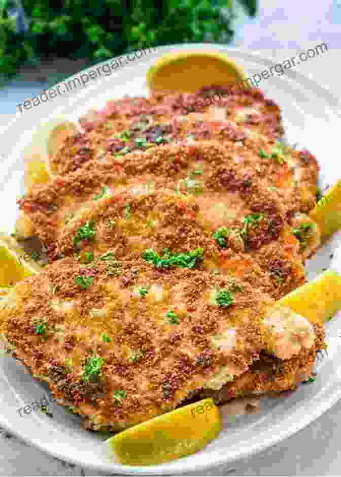 A Golden Brown Schnitzel Served With Lemon Wedges And Parsley Das German Cookbook: Schnitzel Bratwurst Strudel And Other German Classics