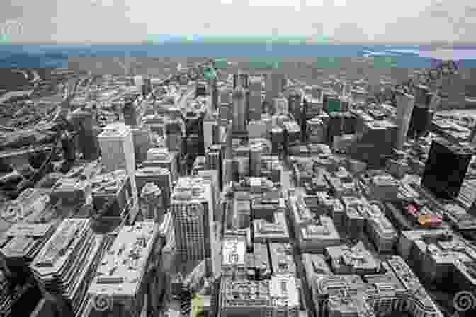 Panoramic View Of A Golden Cornfield Transitioning Into A Modern Town With Tall Buildings And Bustling Streets Last Harvest: From Cornfield To New Town